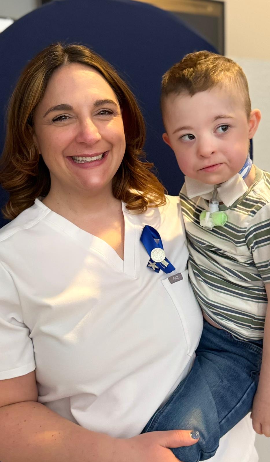 Paula holding her son at pinning